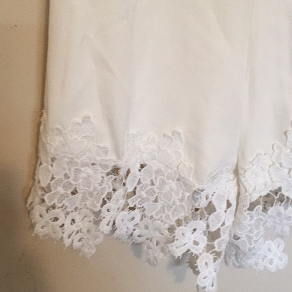 romper with lace details. Slight open back - Picture 2 of 7